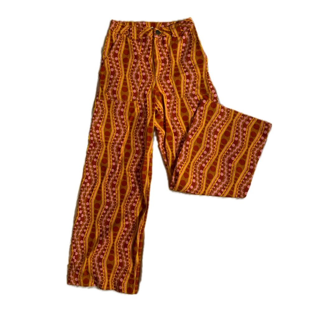Lucy & Yak Orange and red patterned jeans, wide leg 70s retro style